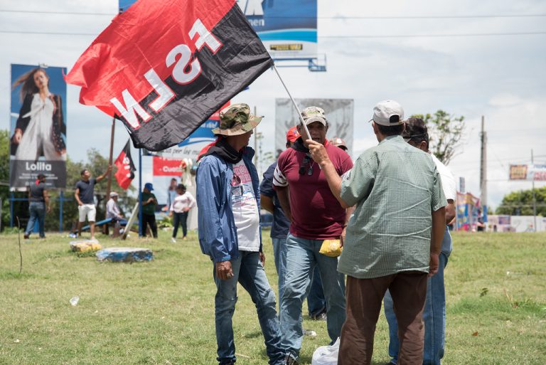 Government workers and FSLN sympathizers at the Managua roundabout, years earlier